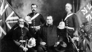 This is an old photo of four military men posing for this photo in uniform. La Maison Macdonell-Williamson House Williamson Military.